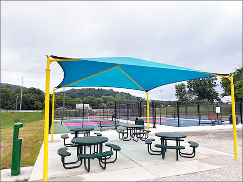 Picnic Tables Beside Tennis Court
